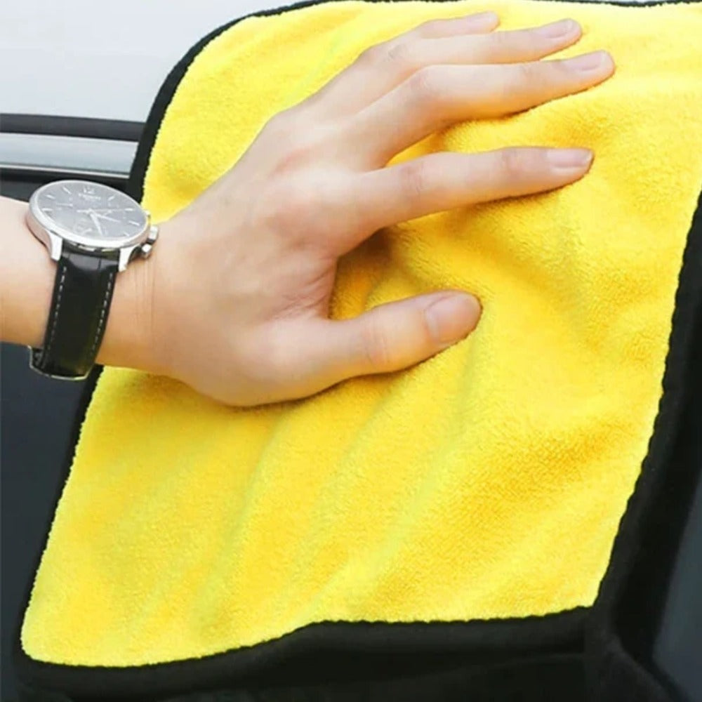 Microfiber towel lifting water and dirt from paint